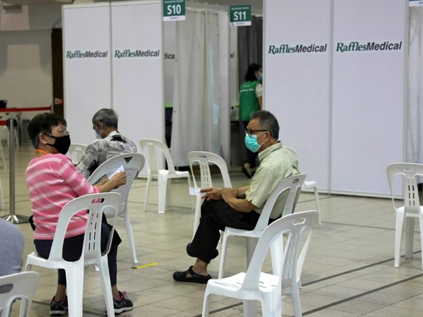 Seniors waiting in the observation zone after getting their Covid-19 vaccinations at Tanjong Pagar Community Centre on Jan 27, 2021.