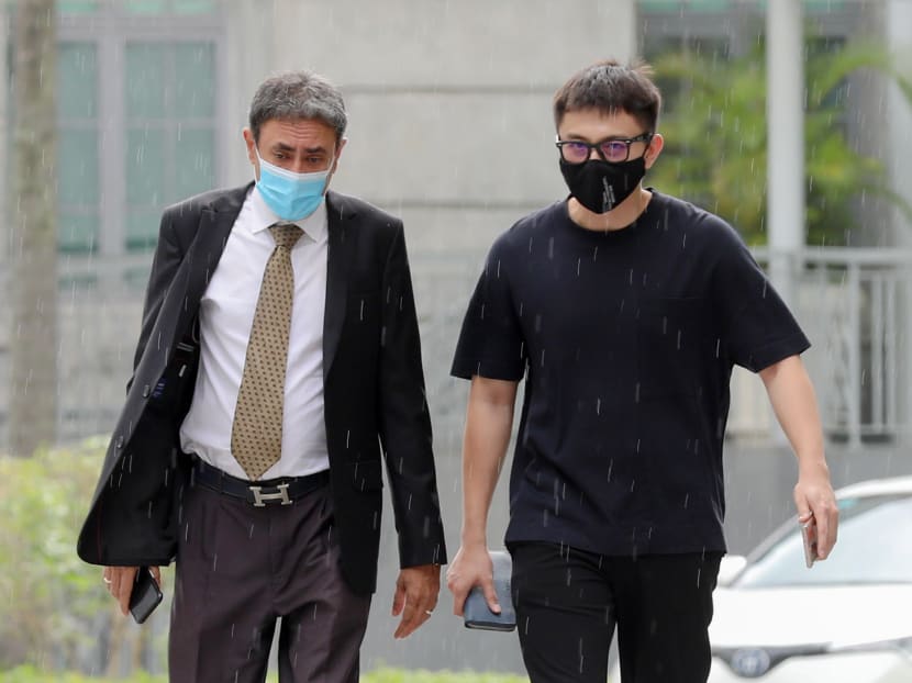 Actor Shane Pow (right) arrives at State Courts on April 22, 2021. The 30-year-old was charged with drink driving.