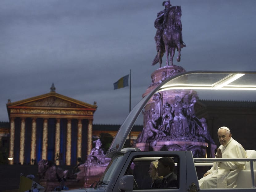 Pope Francis leaves the Benjamin Franklin Parkway in Philadelphia to celebrate a mass at the World Meeting of Families on Sept 26. Photo: AP