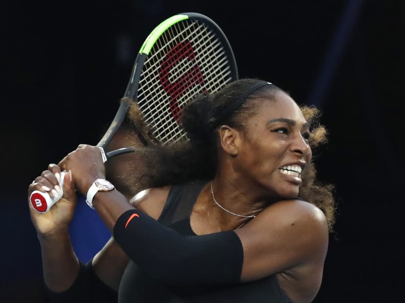 Serena Williams follows through on a backhand return to her sister Venus during the women's singles final at the Australian Open tennis championships in Melbourne, Australia on Jan 28, 2017. Photo: AP