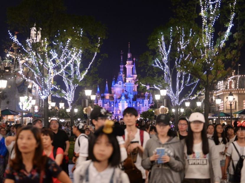 Visitors attending an event to mark the first anniversary of the opening of Shanghai Disneyland, in Shanghai. Photo: AFP