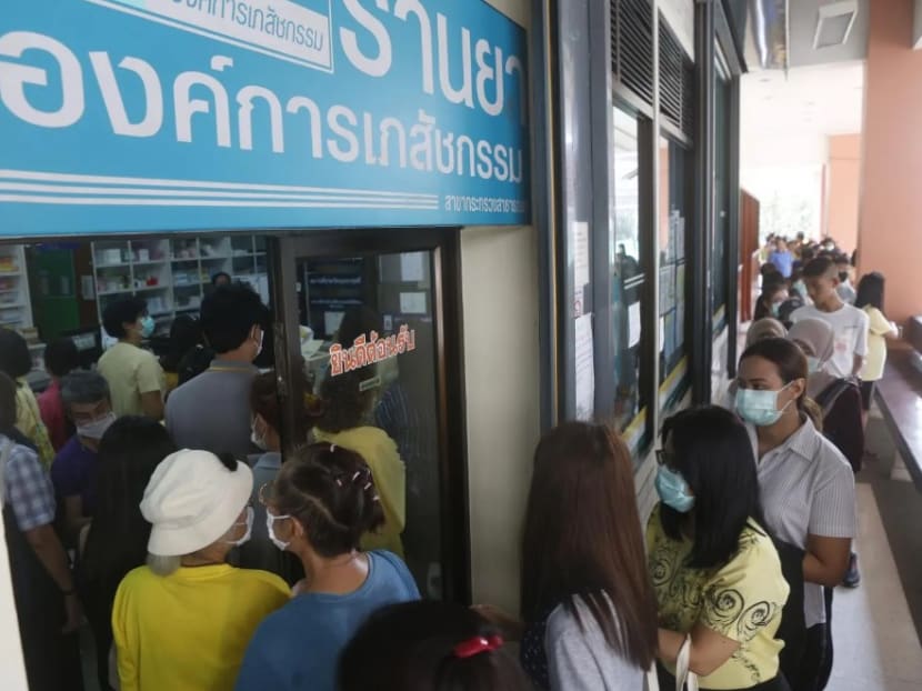 Thais queue to buy hand sanitiser and alcohol gel at a state-run drugstore in Nonthaburi as public concerns over the spread of Covid-19 mount. Thais queue to buy hand sanitiser and alcohol gel at a state-run drugstore in Nonthaburi as public concerns over the spread of Covid-19 mount.