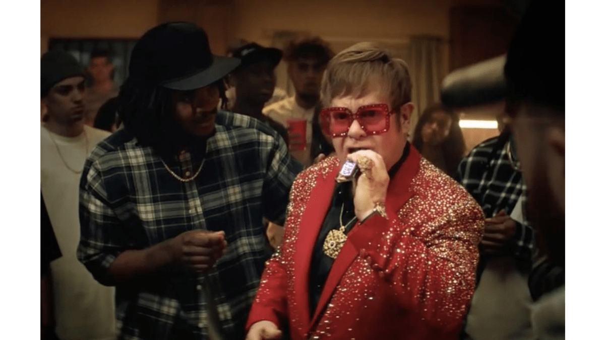 Sir Elton John takes on rap battle for Snickers ad 8days