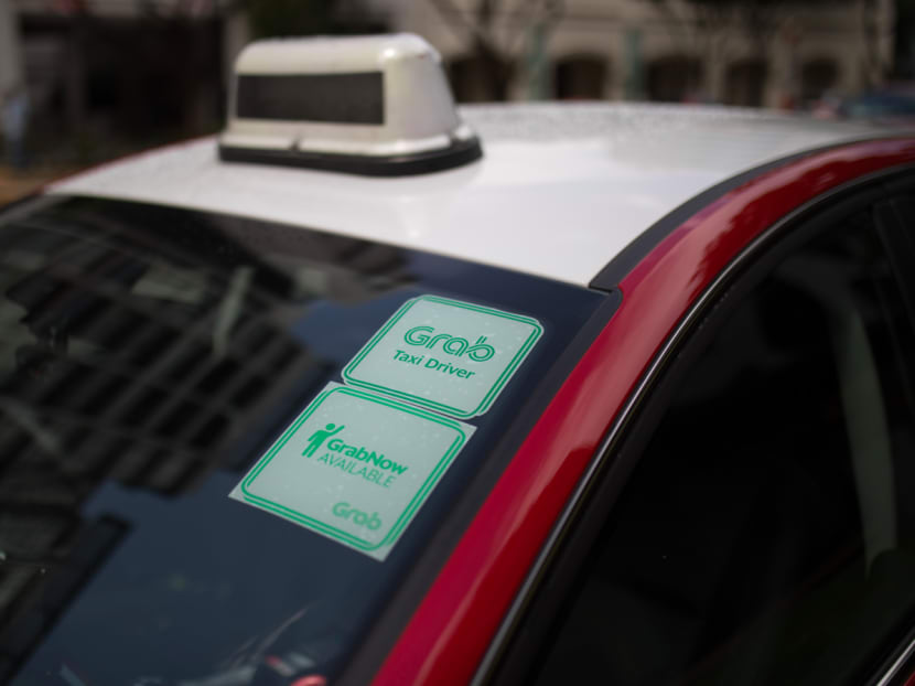 A taxi with a GrabNow sticker pasted on its windscreen. Photo: Grab