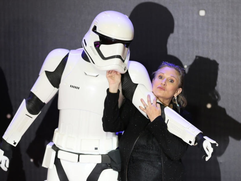 In this file photo, Carrie Fisher poses for cameras as she arrives at the European Premiere of Star Wars, The Force Awakens in Leicester Square, London, December 16, 2015. She died in December 2016. Photo: Reuters