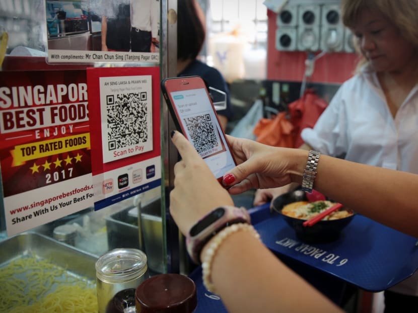A customer using the new QR code payment system at Tanjong Pagar Plaza food centre. Photo: Jason Quah