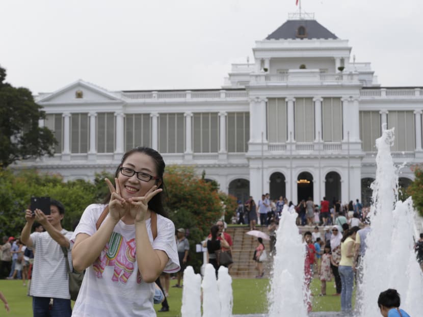 A woman poses for a photo during the Istana Open House on Nov 10, 2015. TODAY file photo
