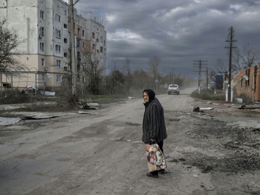 An old woman walks in the Kherson region village of Arkhanhelske on Nov 3, 2022, which was formerly occupied by Russian forces. An old woman walks in the Kherson region village of Arkhanhelske on Nov 3, 2022, which was formerly occupied by Russian forces.