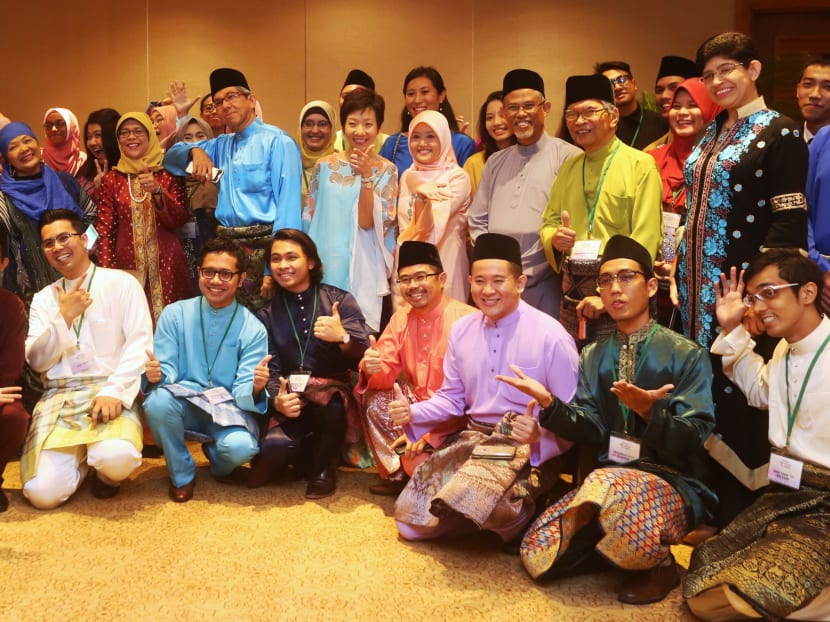 Minister-in-charge of Muslim Affairs Dr Yaacob Ibrahim poses in a group photo with invited guests at the Minister's Hari Raya Get-Together held at the Regent Singapore on 15 Jul 2016. Photo: Ooi Boon Keong/TODAY