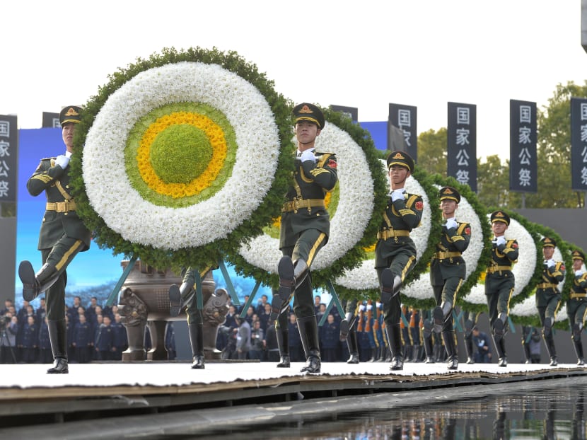 Photo of the day: Paramilitary policemen carrying wreaths as they march during a memorial ceremony in Nanjing, China to mark the 80th anniversary of the 1937 Nanjing Massacre, on the national memorial day on Dec 13, 2017. Photo: Reuters