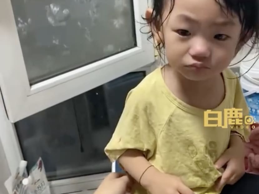 A toddler from China (pictured) called her father a "hooligan" when he tried to bathe her.
