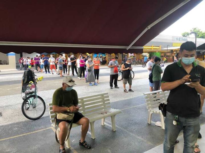 Close to 50 people were in a queue to register for the Sinovac vaccine at HeartlandHealth (Bedok South) clinic on the evening of June 17, 2021.