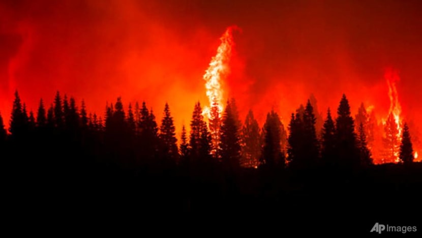 Huge California fire grows as heat spikes again across state