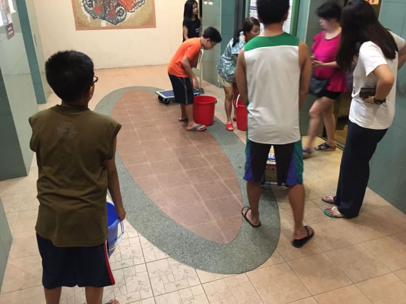 Gallery: Water outage at Toa Payoh HDB block sees residents queue for water