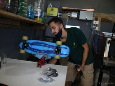 In Brazil favela, skateboards made of bottle caps promote recycling