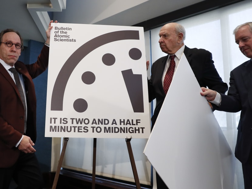 From left, theoretical physicist Lawrence Krauss, chair of the Bulletin of the Atomic Scientists Board of Sponsors; Mr Thomas Pickering, co-chair of the International Crisis Group; and Mr David Titley, a nationally known expert in the field of climate, the Arctic, and national security, unveiled the Doomsday Clock during a news conference at the National Press Club in Washington on Jan 26, 2107. Photo: AP
