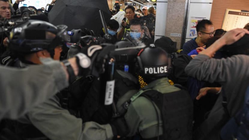 Hong Kong mall protests flare with leader Lam in Beijing