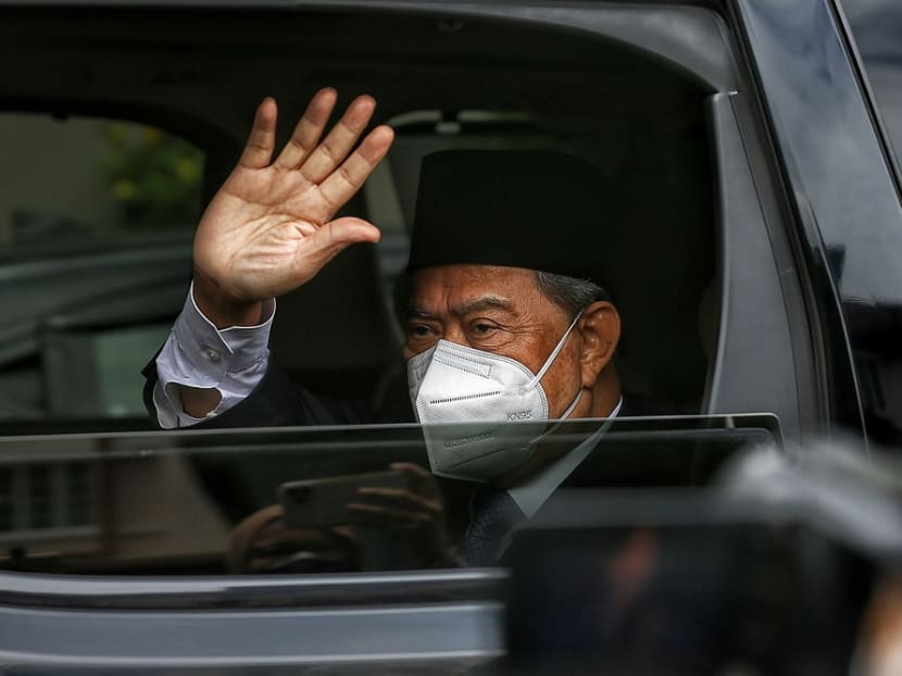 Mr Muhyiddin Yassin waves at members of the media as he arrives at his residence in Bukit Damansara after an audience with the Yang di-Pertuan Agong on Aug 16, 2021. Photo: Malay Mail
