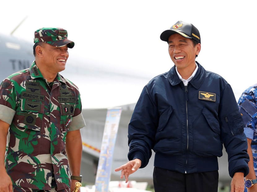 Indonesian President Joko Widodo with military chief Gatot Nurmantyo during an exercise on Natuna Islands, Riau Islands province. The military has resisted attempts by rights groups and academics to discuss the 1965 slaughter of at least 500,000 alleged communists. Photo: Reuters