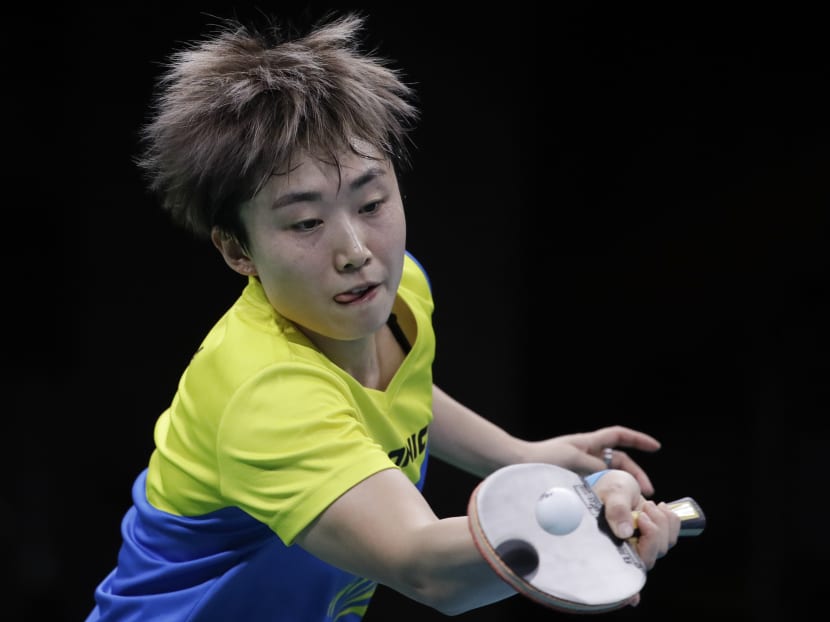 Multiple Olympic medallist and former world team champion Feng Tianwei plays against Ai Fukuhara of Japan during their table tennis match at the 2016 Summer Olympics in Rio de Janeiro, Brazil. Photo: AP