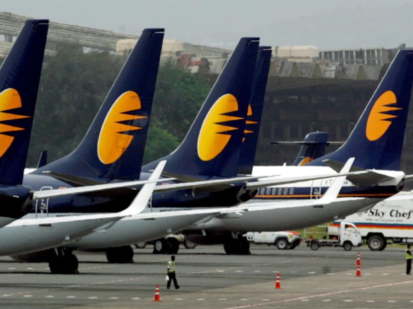 Jet Airways aircraft stand on tarmac at the domestic airport terminal in Mumbai, India.