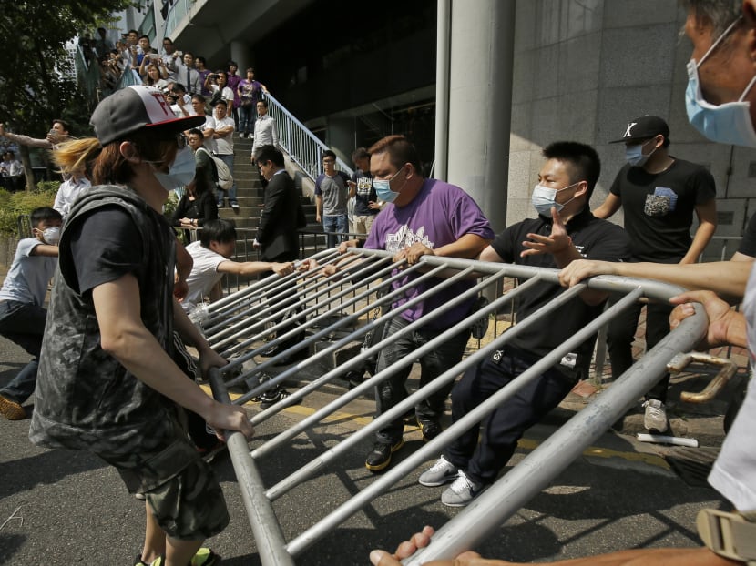 Mobs angry over disruption confront Hong Kong protesters
