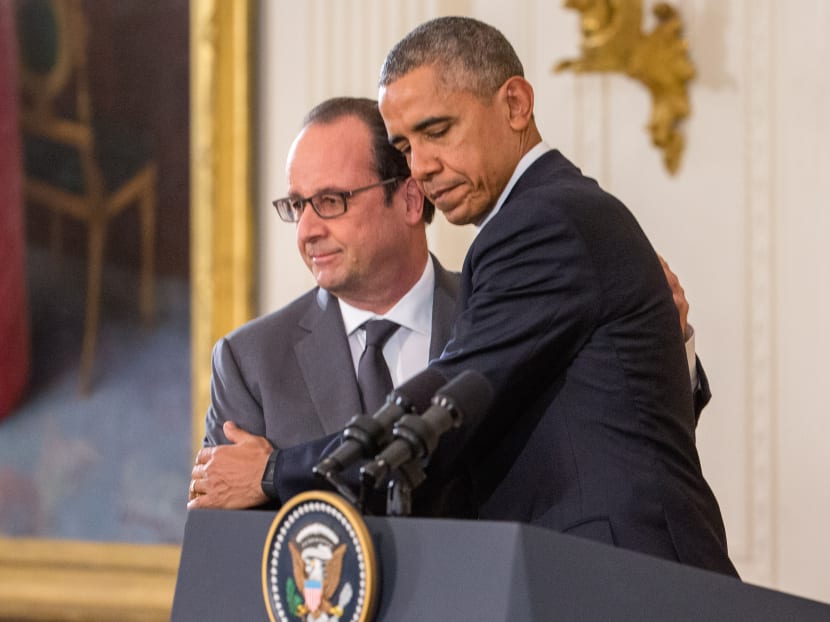 President Barack Obama and French President Francois Hollande embrace during a joint news conference in the East Room of the White House in Washington, Tuesday, Nov. 24, 2015. Photo: AP