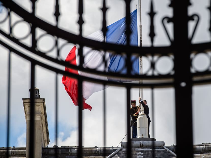 The French flag at half-staff at the Elysee presidential Palace in Paris. France is in national mourning after the attack in Nice on July 14, 2016. Photo: AFP
