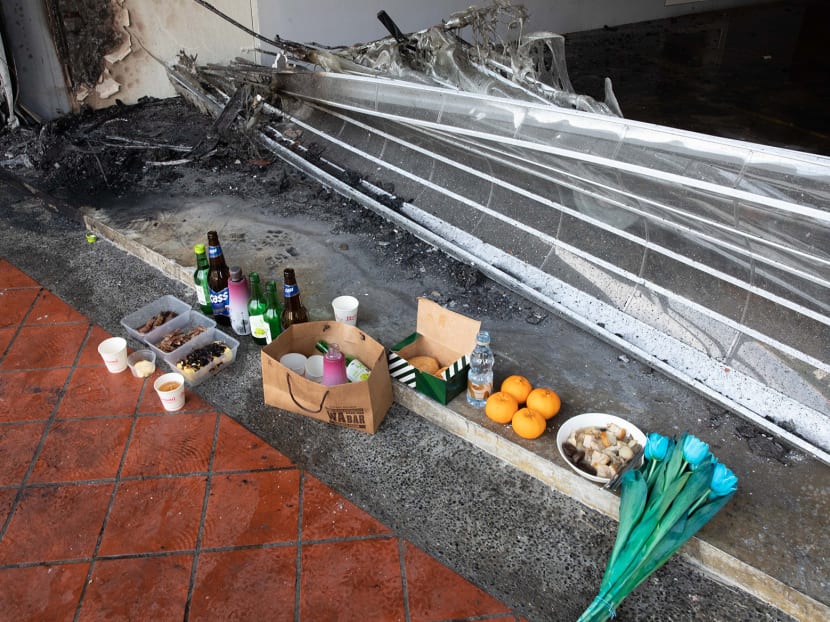 Offerings left at the site of a car crash at 37 Tanjong Pagar Road that killed five people.