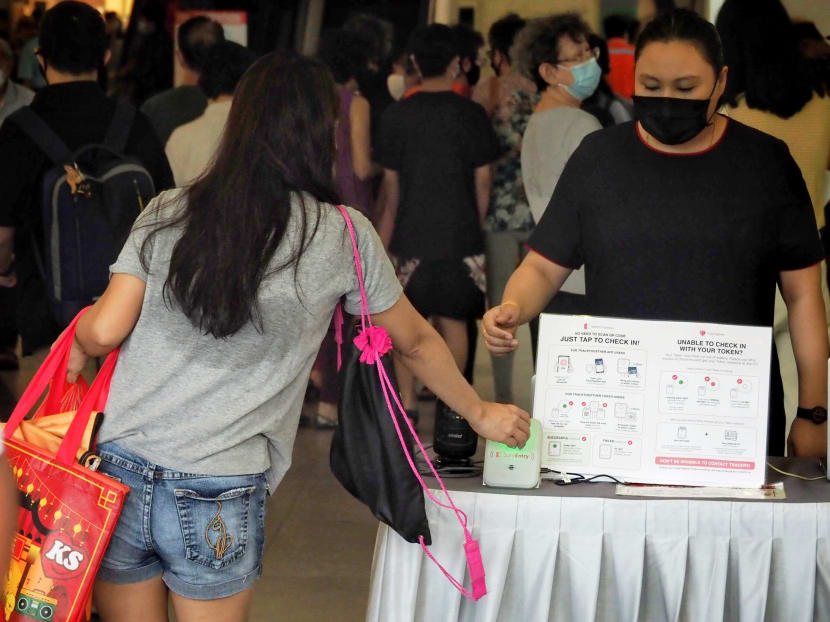 Shoppers have to scan their TraceTogether token or mobile application to do SafeEntry check-ins when entering venues such as malls and public facilities. Shoppers have to scan their TraceTogether token or mobile application to do SafeEntry check-ins when entering venues such as malls and public facilities.