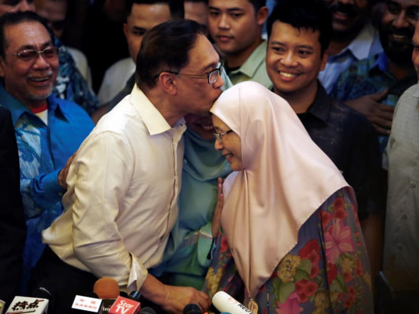 Photo of the day: Longtime opposition leader Anwar Ibrahim kissing his wife during a news conference in Kuala Lumpur, Malaysia after being released from prison on Wednesday, May 16, 2018.