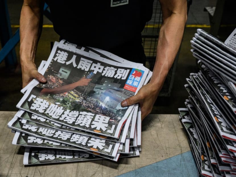 An Apple Daily employee works in the printing room after the last edition of the newspaper is printed in Hong Kong early on June 24, 2021. An Apple Daily employee works in the printing room after the last edition of the newspaper is printed in Hong Kong early on June 24, 2021.