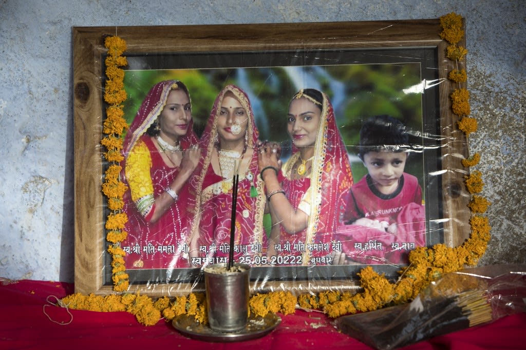 The portrait of three married women (from left) Mamta, Kalu, Kamlesh and Kalu's son Harshit, who were all found dead along with another child in a well in Dudu village on May 28, is pictured at the family home in Chhapya village of India's Rajasthan state on May 31, 2022. The portrait of three married women (from left) Mamta, Kalu, Kamlesh and Kalu's son Harshit, who were all found dead along with another child in a well in Dudu village on May 28, is pictured at the family home in Chhapya village of India's Rajasthan state on May 31, 2022.