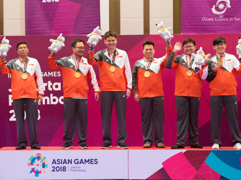 Team Singapore’s contract bridge players on the podium after collecting their men’s team gold medal.