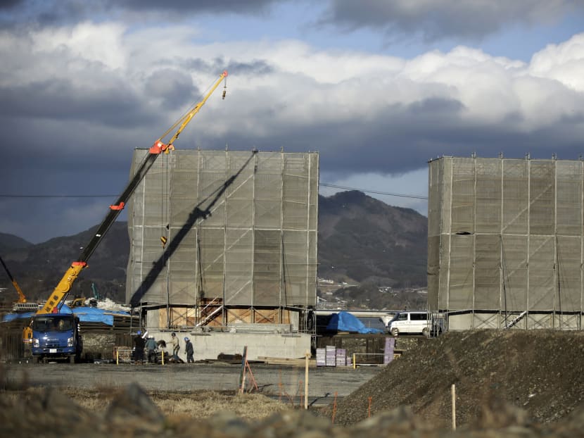 Japan opts for massive, costly sea wall to fend off tsunamis
