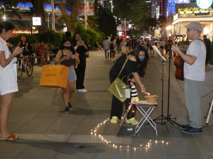 A busker along the Orchard Road shopping belt.