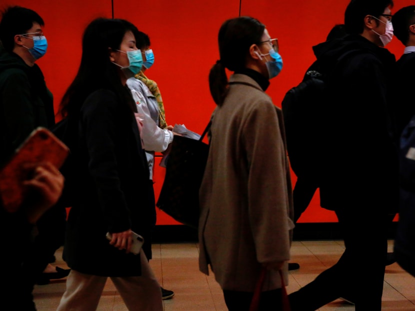 People wearing protective masks during their morning commute in Hong Kong, on Feb 10, 2020.