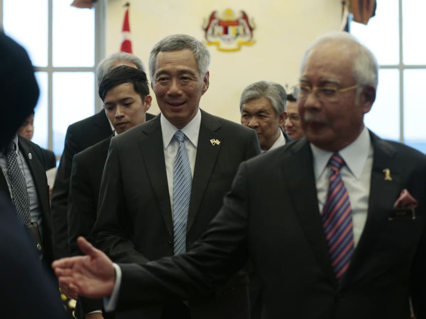 Singapore's PM Lee Hsien Loong and Malaysia's PM Najib Razak leave after a joint press conference in Putrajaya on Dec 13, 2016. Photo: Jason Quah/TODAY