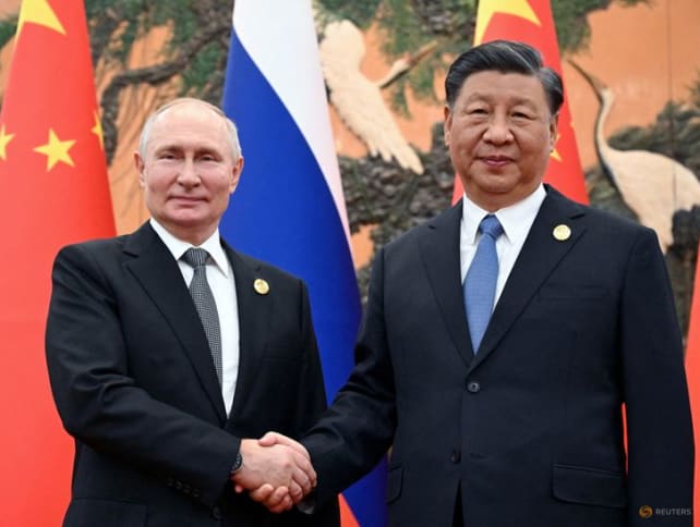 Russian President Vladimir Putin shakes hands with Chinese President Xi Jinping during a meeting at the Belt and Road Forum in Beijing, China, Oct 18, 2023.