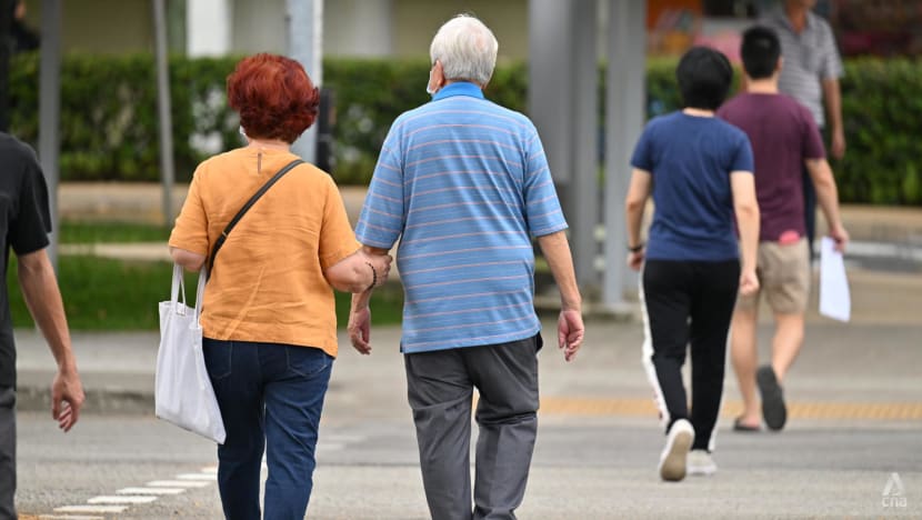 an elderly couple crosses the road in toa payoh on thursday feb 8