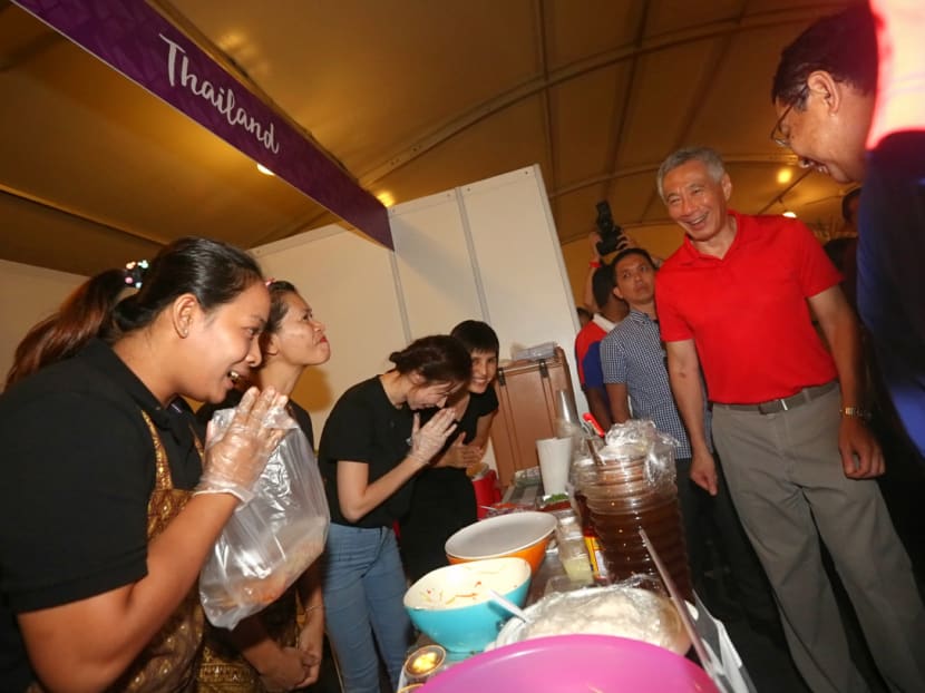 Prime Minister Lee Hsien Loong visits the Thailand booth at the 'Experience ASEAN' carnival organised by the Ministry of Foreign Affairs to launch Singapore's chairmanship of ASEAN 2018. Photo: Nuria Ling/TODAY