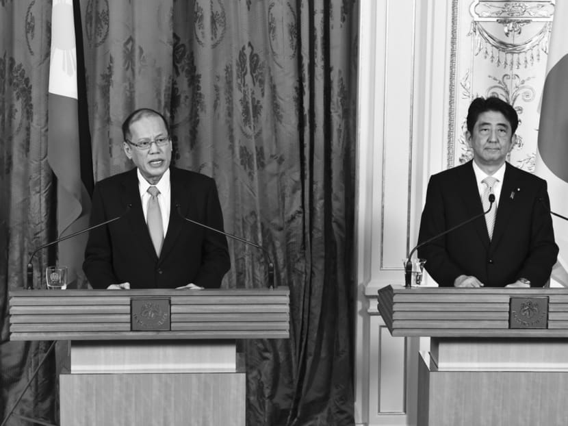 Philippine President Benigno Aquino (left) and Mr Abe at a Tokyo news conference this month. Mr Abe is deepening ties with countries confronting Beijing’s ambitions in the South China Sea. Photo: REUTERS