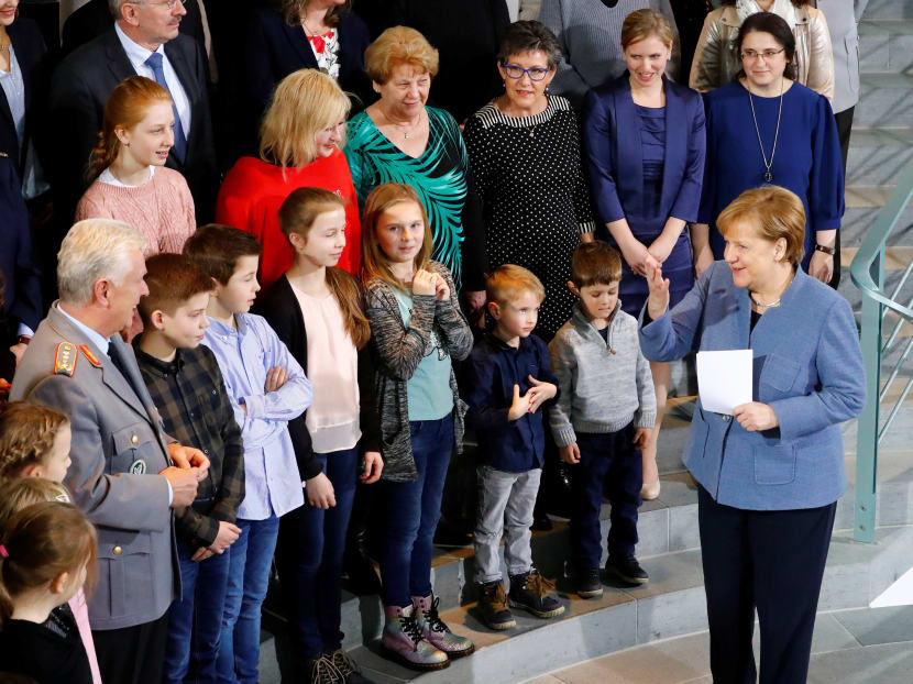 With women such as German Chancellor Angela Merkel leading countries and companies, do they really need to worry whether anyone knows if they are mothers, asks the author.  Photo: Reuters