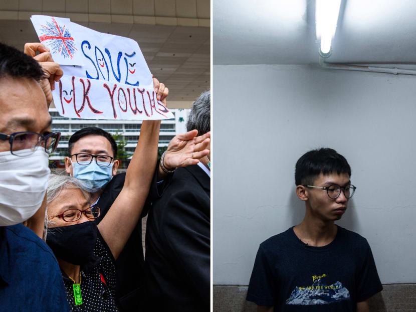 Activist Alexandra Wong (left), 64, holds up a sign that reads "Save HK Youths" outside the West Kowloon Magistrates Court in Hong Kong on Oct 29, 2020, after local teenage democracy activist Tony Chung (right), 19, was charged with secession under the new National Security Law.