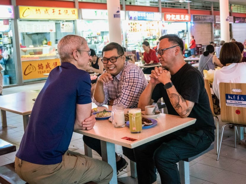 Apple CEO Tim Cook (far left) tweeted about his experience in Singapore to his 11.6 million followers. He is seen here with Singapore photographers Darren Soh (second from left) and Aik Beng Chia.