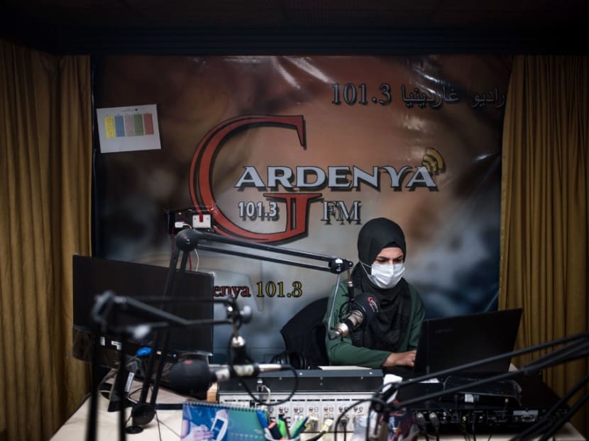 Gardenya FM radio journalist Sherin Mohammad records a programme at the station's studio at the Arbat refugee camp on Nov 3, 2020.