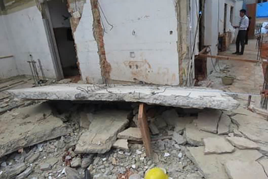 The collapsed slab that killed the worker identified in court documents only as Santo. The collapsed slab that killed the worker identified in court documents only as Santo.