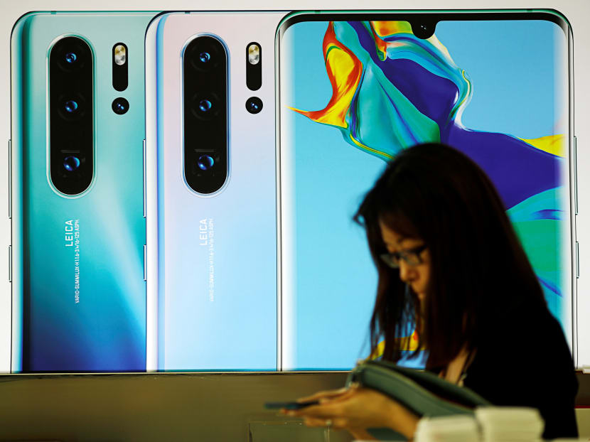 A Huawei P30 phone advertisement at a mobile phone shop in Singapore on May 21, 2019.
