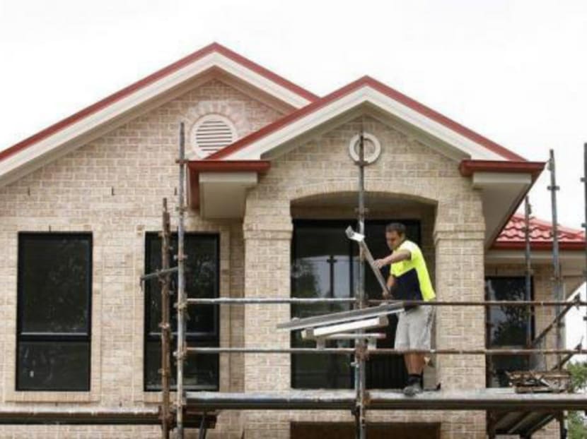 A man works on a house in Sydney. Reuters file photo