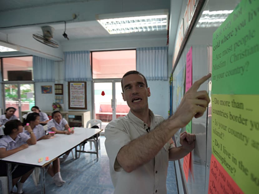 Mr Guillaume Langlois teaches English to students at Kunnatee Ruttharam Wittayakom School in this 2012 file photo. Photo: Bangkok Post